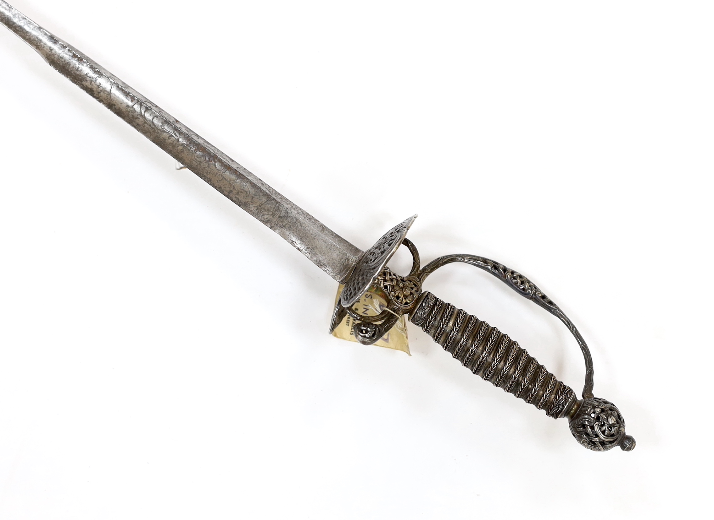 A French silver hilted small sword, c.1770, the ricasso rings have two tiny marks struck on the end which possibly could be Paris discharge marks, the hilt pierced with basketweave decoration and flowers, silver wire and